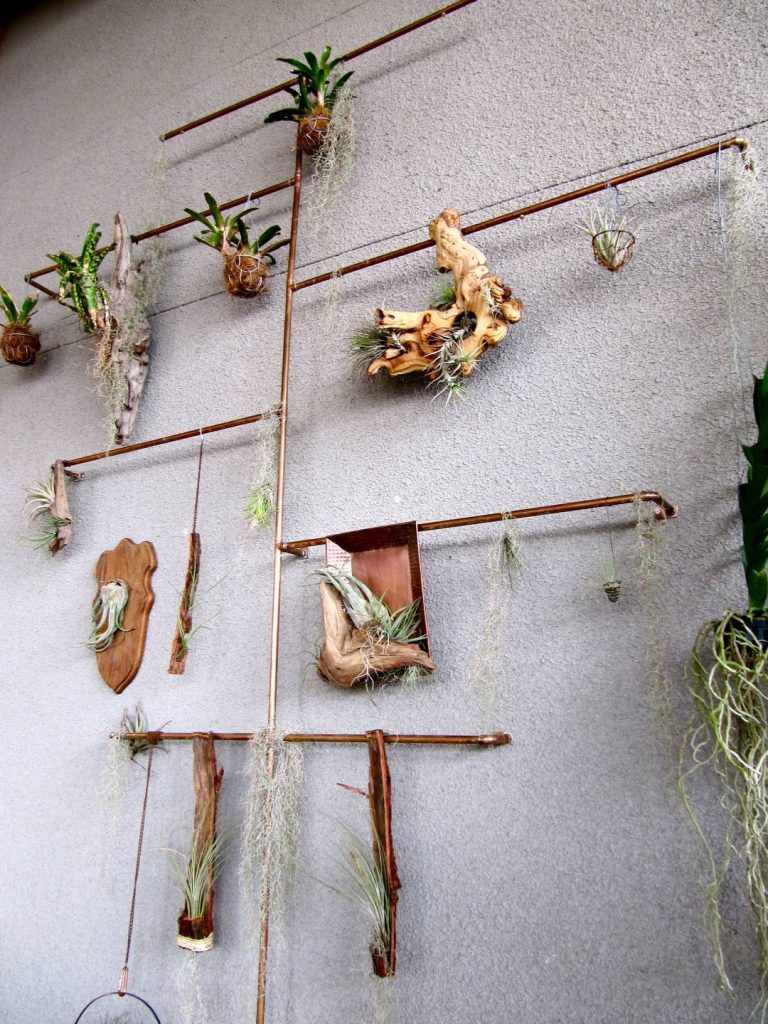 copper pipe plant display living room design