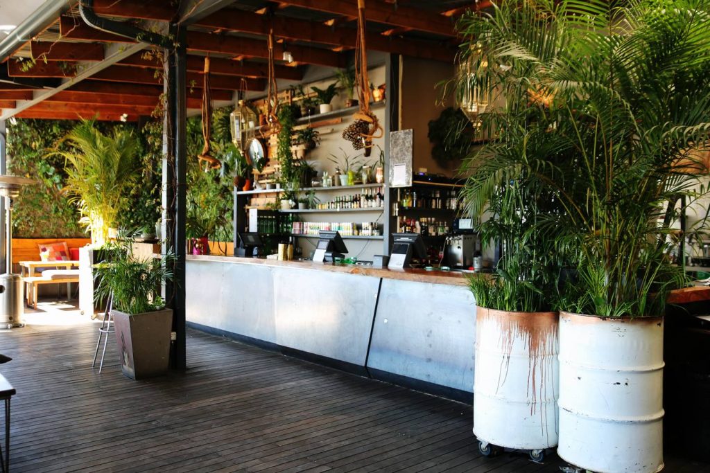 custom bar design and vertical garden living room